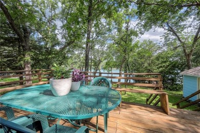 This quaint and charming LAKEFRONT bungalow offers a peaceful on Linn Valley Lakes - Deer Trace Golf Course in Kansas - for sale on GolfHomes.com, golf home, golf lot