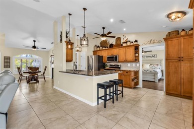 Welcome Home!  Impeccably Maintained 4-bedroom Salt Water Pool on Seminole Lakes Country Club in Florida - for sale on GolfHomes.com, golf home, golf lot