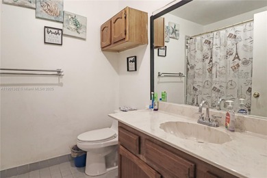 This home features a spacious layout with tile flooring on Palmetto Golf Course in Florida - for sale on GolfHomes.com, golf home, golf lot