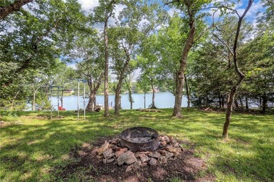 This quaint and charming LAKEFRONT bungalow offers a peaceful on Linn Valley Lakes - Deer Trace Golf Course in Kansas - for sale on GolfHomes.com, golf home, golf lot