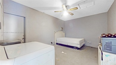 This home features a spacious layout with tile flooring on Palmetto Golf Course in Florida - for sale on GolfHomes.com, golf home, golf lot