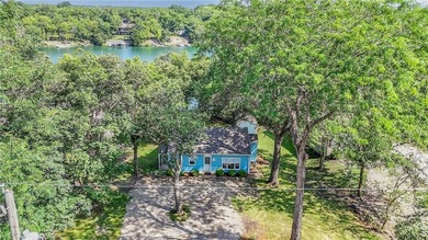 This quaint and charming LAKEFRONT bungalow offers a peaceful on Linn Valley Lakes - Deer Trace Golf Course in Kansas - for sale on GolfHomes.com, golf home, golf lot