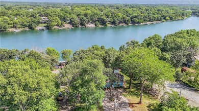 This quaint and charming LAKEFRONT bungalow offers a peaceful on Linn Valley Lakes - Deer Trace Golf Course in Kansas - for sale on GolfHomes.com, golf home, golf lot