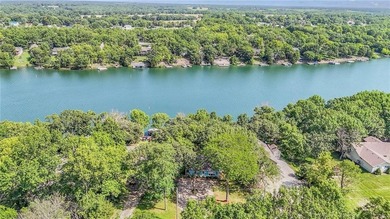 This quaint and charming LAKEFRONT bungalow offers a peaceful on Linn Valley Lakes - Deer Trace Golf Course in Kansas - for sale on GolfHomes.com, golf home, golf lot