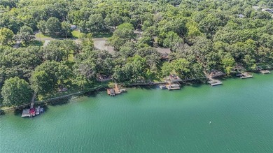 This quaint and charming LAKEFRONT bungalow offers a peaceful on Linn Valley Lakes - Deer Trace Golf Course in Kansas - for sale on GolfHomes.com, golf home, golf lot