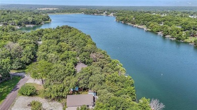 This quaint and charming LAKEFRONT bungalow offers a peaceful on Linn Valley Lakes - Deer Trace Golf Course in Kansas - for sale on GolfHomes.com, golf home, golf lot