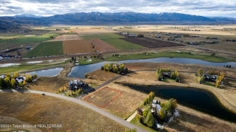 Beautiful 0.44-acre homesite at Teton Springs offering both pond on Teton Springs Resort and Club in Idaho - for sale on GolfHomes.com, golf home, golf lot