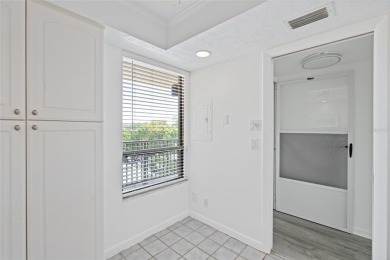 This bright and cheerful 2/2 Cove Cay gem is priced to sell! on Cove Cay Country Club in Florida - for sale on GolfHomes.com, golf home, golf lot