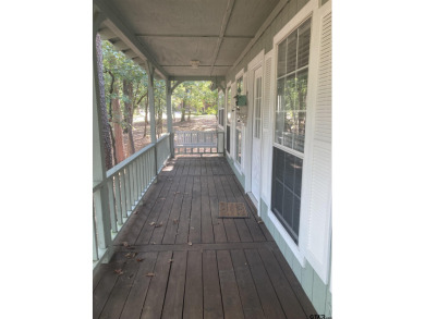 This one-owner home sits on three wooded lots for a total of .75 on Holly Lake Ranch Golf Club in Texas - for sale on GolfHomes.com, golf home, golf lot
