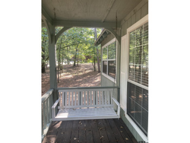 This one-owner home sits on three wooded lots for a total of .75 on Holly Lake Ranch Golf Club in Texas - for sale on GolfHomes.com, golf home, golf lot