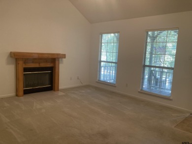 This one-owner home sits on three wooded lots for a total of .75 on Holly Lake Ranch Golf Club in Texas - for sale on GolfHomes.com, golf home, golf lot
