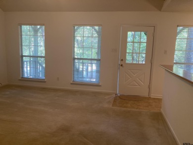 This one-owner home sits on three wooded lots for a total of .75 on Holly Lake Ranch Golf Club in Texas - for sale on GolfHomes.com, golf home, golf lot