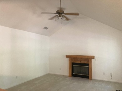 This one-owner home sits on three wooded lots for a total of .75 on Holly Lake Ranch Golf Club in Texas - for sale on GolfHomes.com, golf home, golf lot