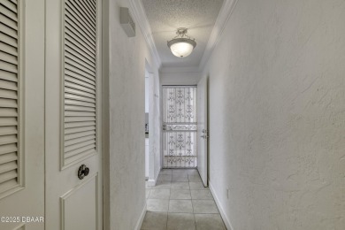 Enjoy easy living in this beautifully furnished 2-bedroom on Daytona Beach Golf Club in Florida - for sale on GolfHomes.com, golf home, golf lot