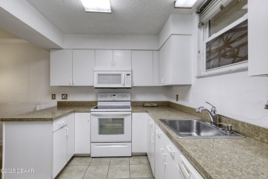 Enjoy easy living in this beautifully furnished 2-bedroom on Daytona Beach Golf Club in Florida - for sale on GolfHomes.com, golf home, golf lot
