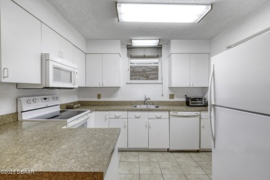 Enjoy easy living in this beautifully furnished 2-bedroom on Daytona Beach Golf Club in Florida - for sale on GolfHomes.com, golf home, golf lot