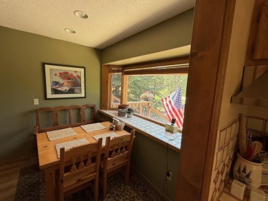 Conveniently located 3 bedrooms, 2 1/2-bathroom cabin in Angel on Angel Fire Resort Country Club in New Mexico - for sale on GolfHomes.com, golf home, golf lot