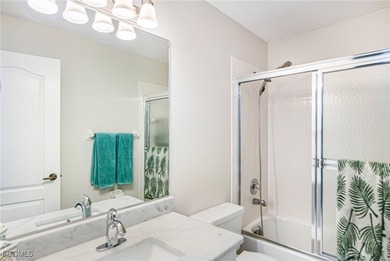 Discover Florida living at its finest in this beautifully on Olde Hickory Golf and Country Club in Florida - for sale on GolfHomes.com, golf home, golf lot