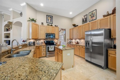 Under contract-accepting backup offers. Lovely 4 bedroom, 3 bath on TPC of Tampa Bay in Florida - for sale on GolfHomes.com, golf home, golf lot