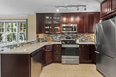 This updated 4-bedroom, 3-bathroom townhome in the gated Key on Key West Golf Club in Florida - for sale on GolfHomes.com, golf home, golf lot
