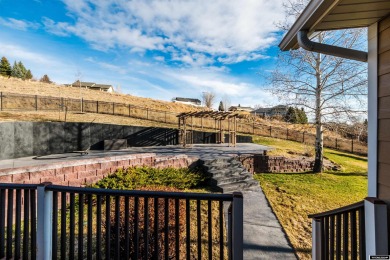 Beautiful custom home that overlooks the golf course & the city on Buffalo Golf Club in Wyoming - for sale on GolfHomes.com, golf home, golf lot