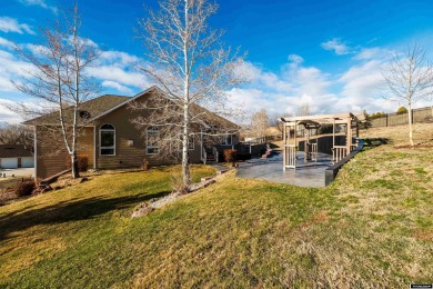 Beautiful custom home that overlooks the golf course & the city on Buffalo Golf Club in Wyoming - for sale on GolfHomes.com, golf home, golf lot