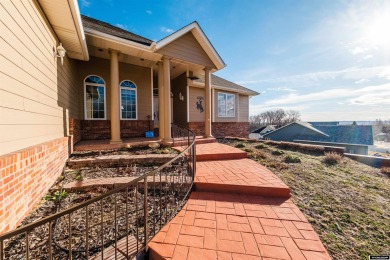 Beautiful custom home that overlooks the golf course & the city on Buffalo Golf Club in Wyoming - for sale on GolfHomes.com, golf home, golf lot