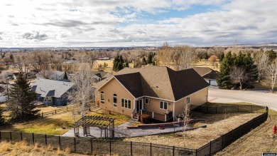 Beautiful custom home that overlooks the golf course & the city on Buffalo Golf Club in Wyoming - for sale on GolfHomes.com, golf home, golf lot