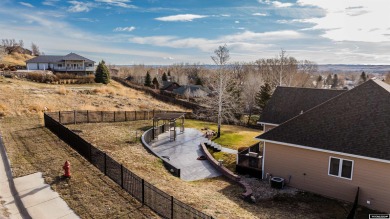 Beautiful custom home that overlooks the golf course & the city on Buffalo Golf Club in Wyoming - for sale on GolfHomes.com, golf home, golf lot