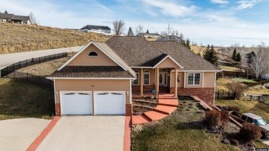 Beautiful custom home that overlooks the golf course & the city on Buffalo Golf Club in Wyoming - for sale on GolfHomes.com, golf home, golf lot