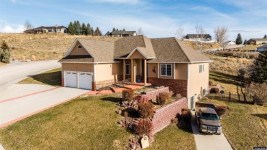 Beautiful custom home that overlooks the golf course & the city on Buffalo Golf Club in Wyoming - for sale on GolfHomes.com, golf home, golf lot