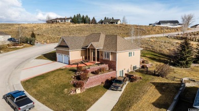 Beautiful custom home that overlooks the golf course & the city on Buffalo Golf Club in Wyoming - for sale on GolfHomes.com, golf home, golf lot