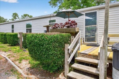 This  two bedroom, two bath home located in the sought after on Oyster Bay Golf Links in North Carolina - for sale on GolfHomes.com, golf home, golf lot