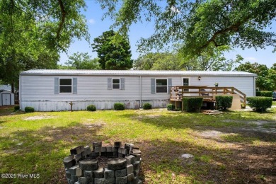 This  two bedroom, two bath home located in the sought after on Oyster Bay Golf Links in North Carolina - for sale on GolfHomes.com, golf home, golf lot