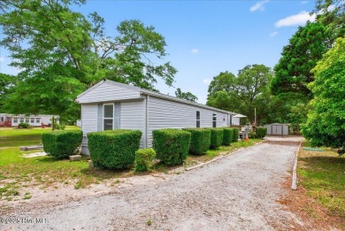 This  two bedroom, two bath home located in the sought after on Oyster Bay Golf Links in North Carolina - for sale on GolfHomes.com, golf home, golf lot