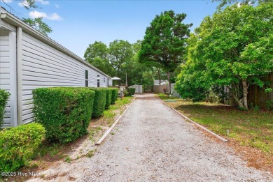 This  two bedroom, two bath home located in the sought after on Oyster Bay Golf Links in North Carolina - for sale on GolfHomes.com, golf home, golf lot