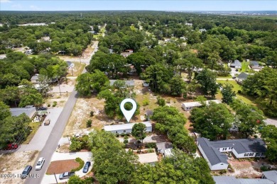 This  two bedroom, two bath home located in the sought after on Oyster Bay Golf Links in North Carolina - for sale on GolfHomes.com, golf home, golf lot