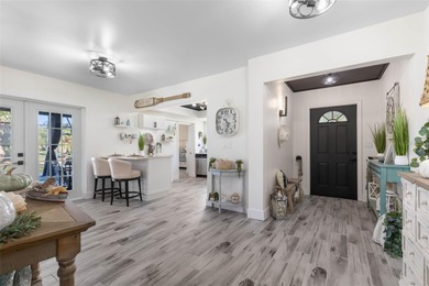 Step inside and exhale--from morning coffee by the pool to on Palm Harbor Golf Club in Florida - for sale on GolfHomes.com, golf home, golf lot