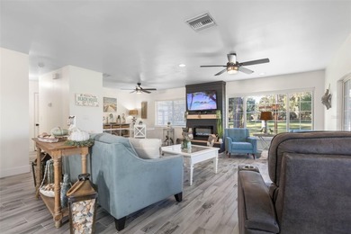 Step inside and exhale--from morning coffee by the pool to on Palm Harbor Golf Club in Florida - for sale on GolfHomes.com, golf home, golf lot