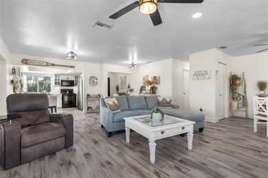 Step inside and exhale--from morning coffee by the pool to on Palm Harbor Golf Club in Florida - for sale on GolfHomes.com, golf home, golf lot