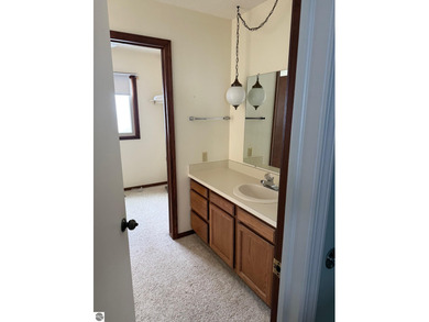 Green Meadows Condominiums ground-floor unit in a rare two-story on Bay Meadows Golf Course - Executive in Michigan - for sale on GolfHomes.com, golf home, golf lot