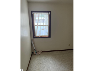 Green Meadows Condominiums ground-floor unit in a rare two-story on Bay Meadows Golf Course - Executive in Michigan - for sale on GolfHomes.com, golf home, golf lot