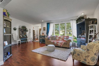 Welcome to this stunning home, where warmth and elegance await on The Grand Club - Pine Lakes Course in Florida - for sale on GolfHomes.com, golf home, golf lot