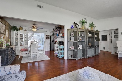 Welcome to this stunning home, where warmth and elegance await on The Grand Club - Pine Lakes Course in Florida - for sale on GolfHomes.com, golf home, golf lot