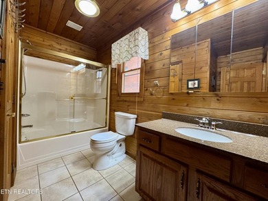 Stunning Log Cabin style Retreat on Norris Lake - Community on The Greens at Deerfield in Tennessee - for sale on GolfHomes.com, golf home, golf lot