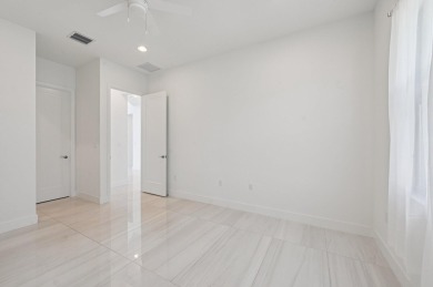 New Lakefront Home | 5BD + In-Law Suite | Designer curated on Boca Raton Municipal Golf Course in Florida - for sale on GolfHomes.com, golf home, golf lot