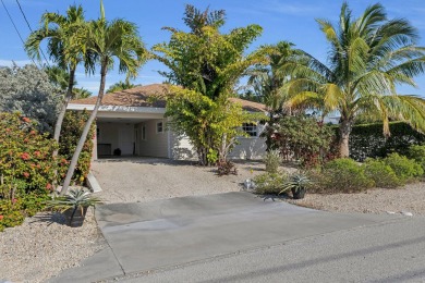 Convenient, spacious and private are many of the words used to on Key Colony Beach Golf Course in Florida - for sale on GolfHomes.com, golf home, golf lot