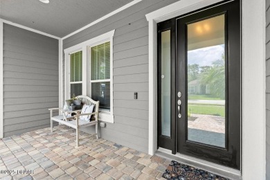 Welcome Home to your private oasis nestled along a peaceful on Plantation Bay Golf and Country Club in Florida - for sale on GolfHomes.com, golf home, golf lot