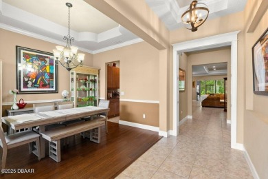 Welcome Home to your private oasis nestled along a peaceful on Plantation Bay Golf and Country Club in Florida - for sale on GolfHomes.com, golf home, golf lot