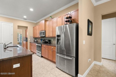 Welcome Home to your private oasis nestled along a peaceful on Plantation Bay Golf and Country Club in Florida - for sale on GolfHomes.com, golf home, golf lot